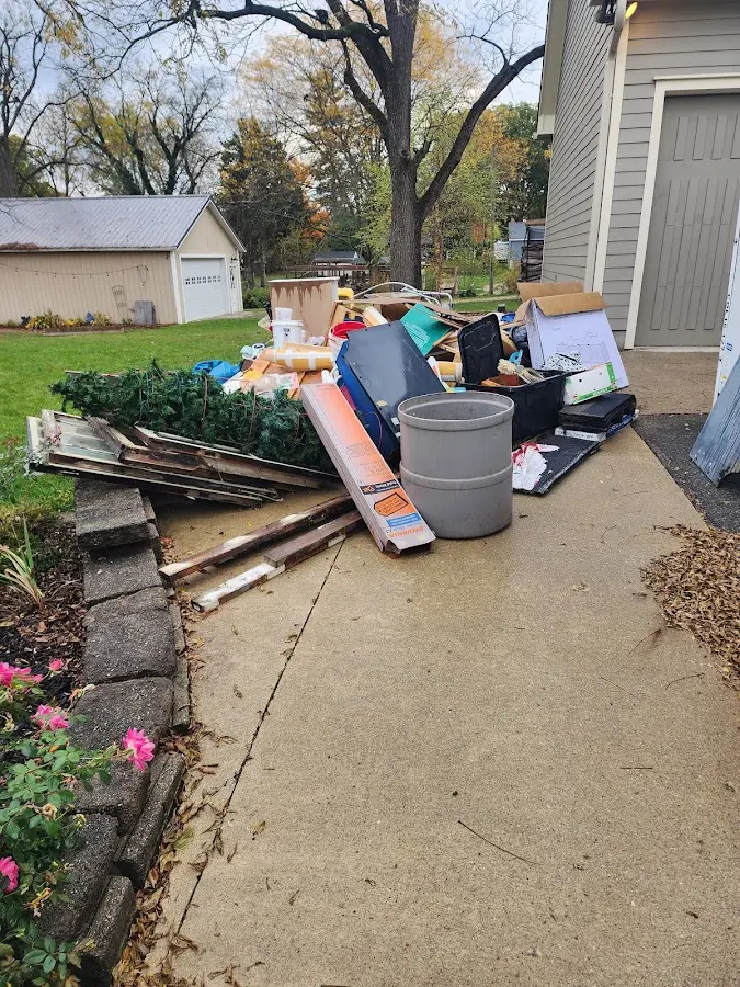 Dumpster being loaded with debris for 3 Yard Dumpster Rental in Los Lunas